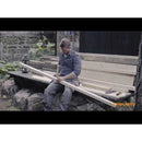 Универсален нож с вградено точило в канията Fiskars показан при рязане на дъски на открито, удобна дръжка и интегрирано точило