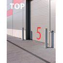 Външен изглед на склад с дренажен канал и стълбове, номер 5, за обозначаване на зона.